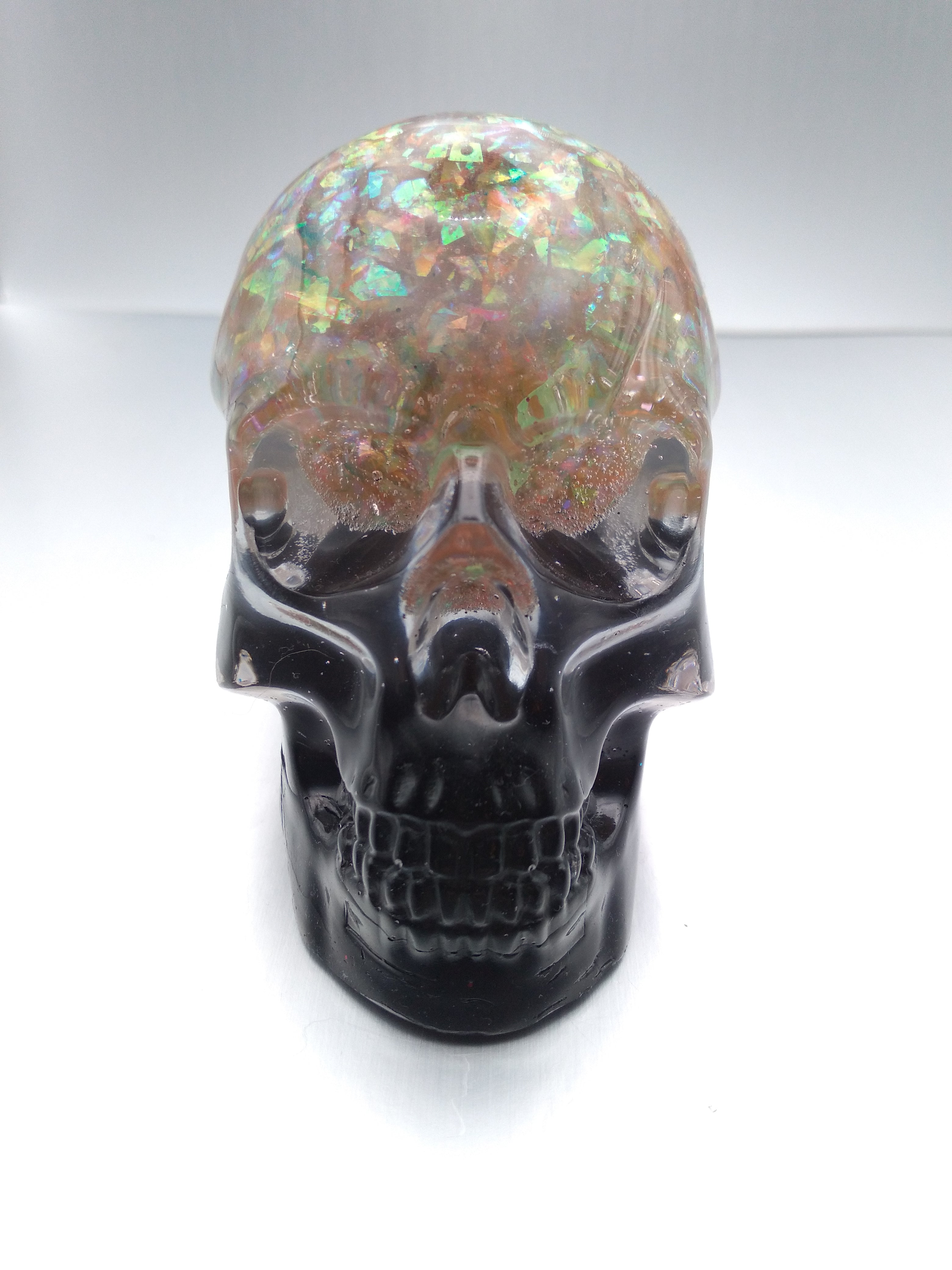 Black and iridescent skull
