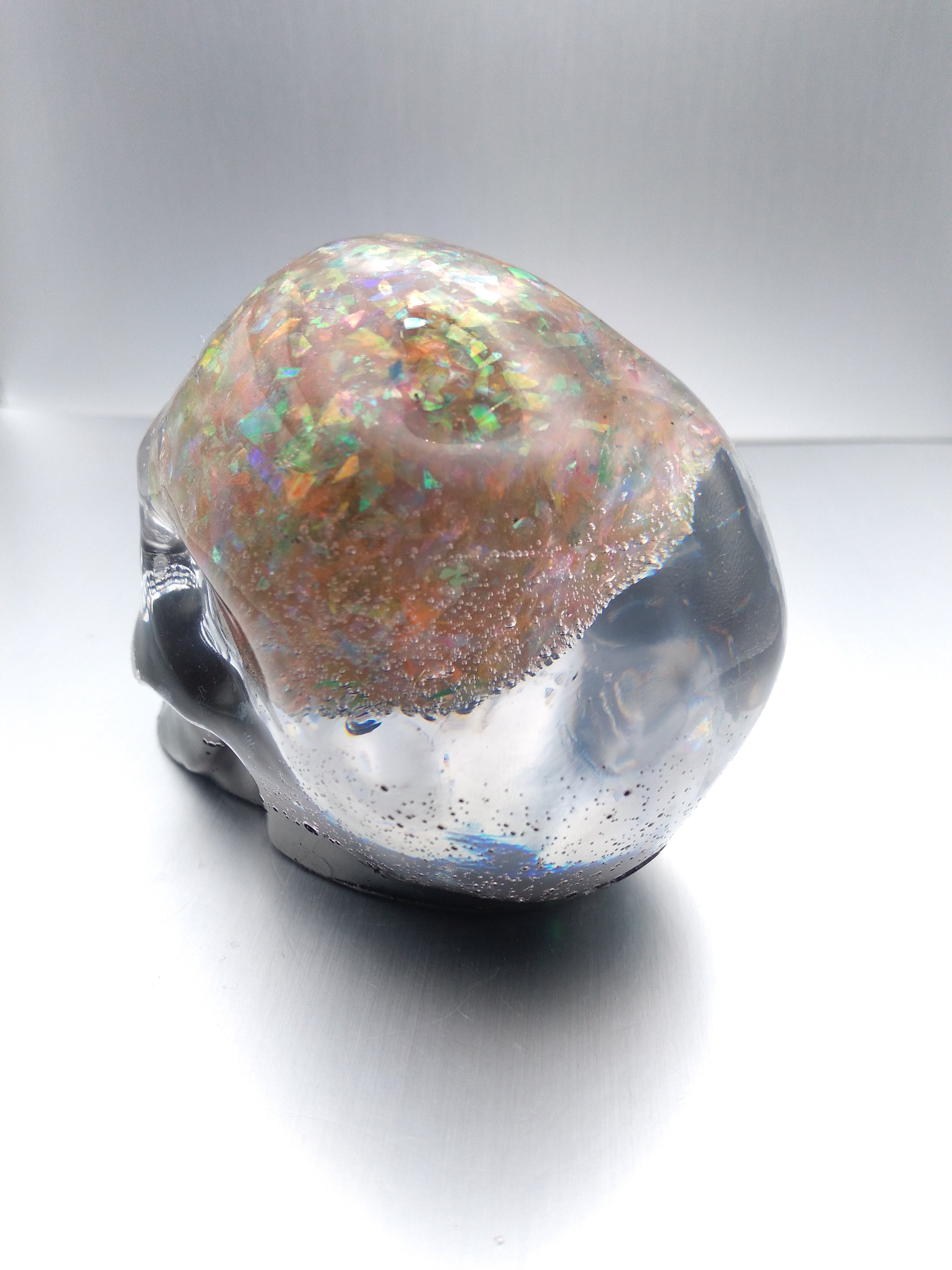 Black and iridescent skull