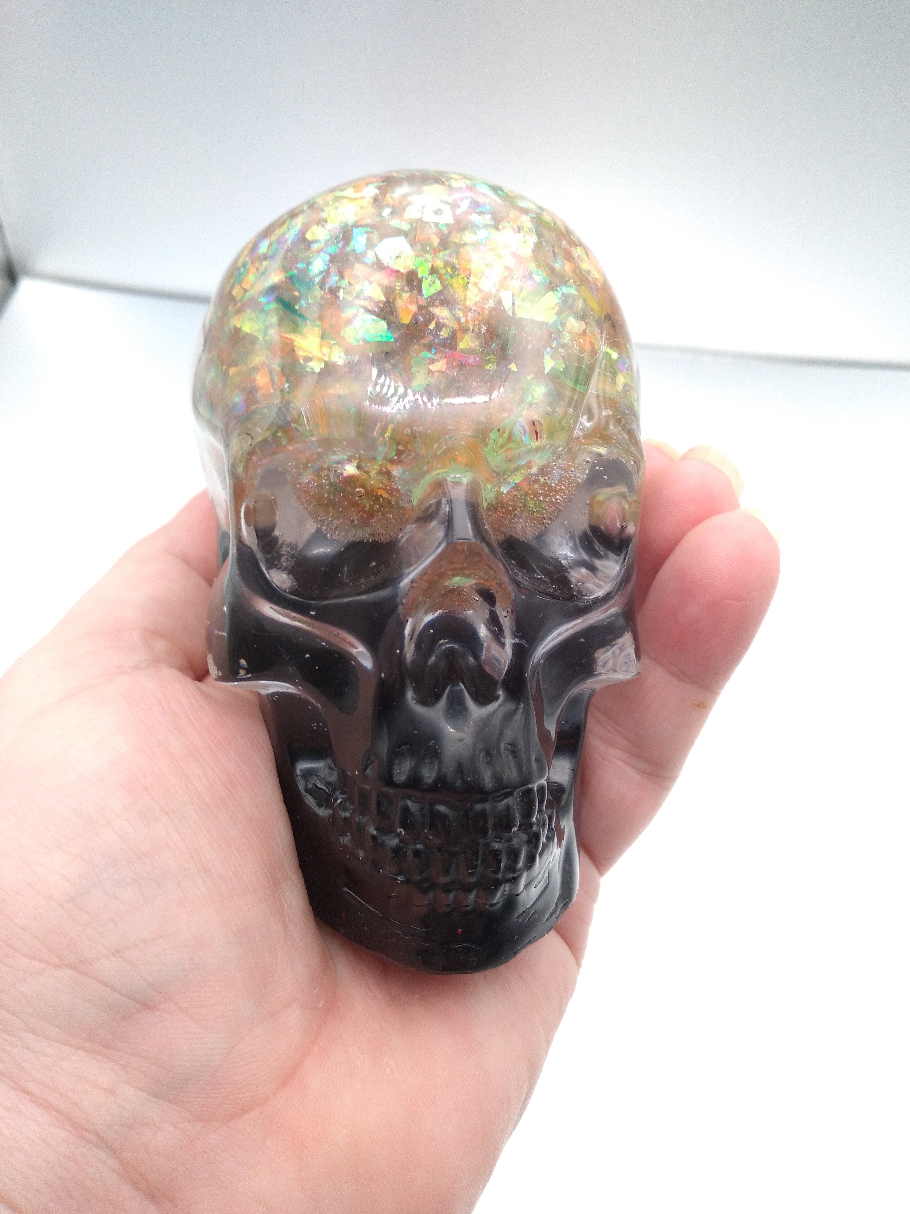 Black and iridescent skull