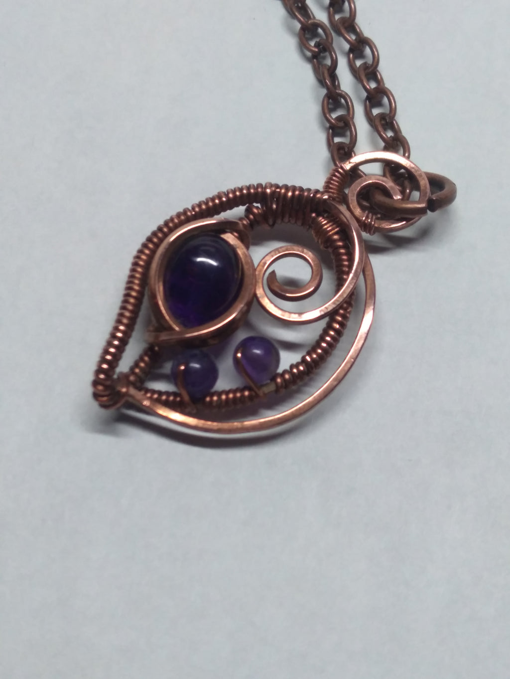 Amethyst and copper 3 stone pendant