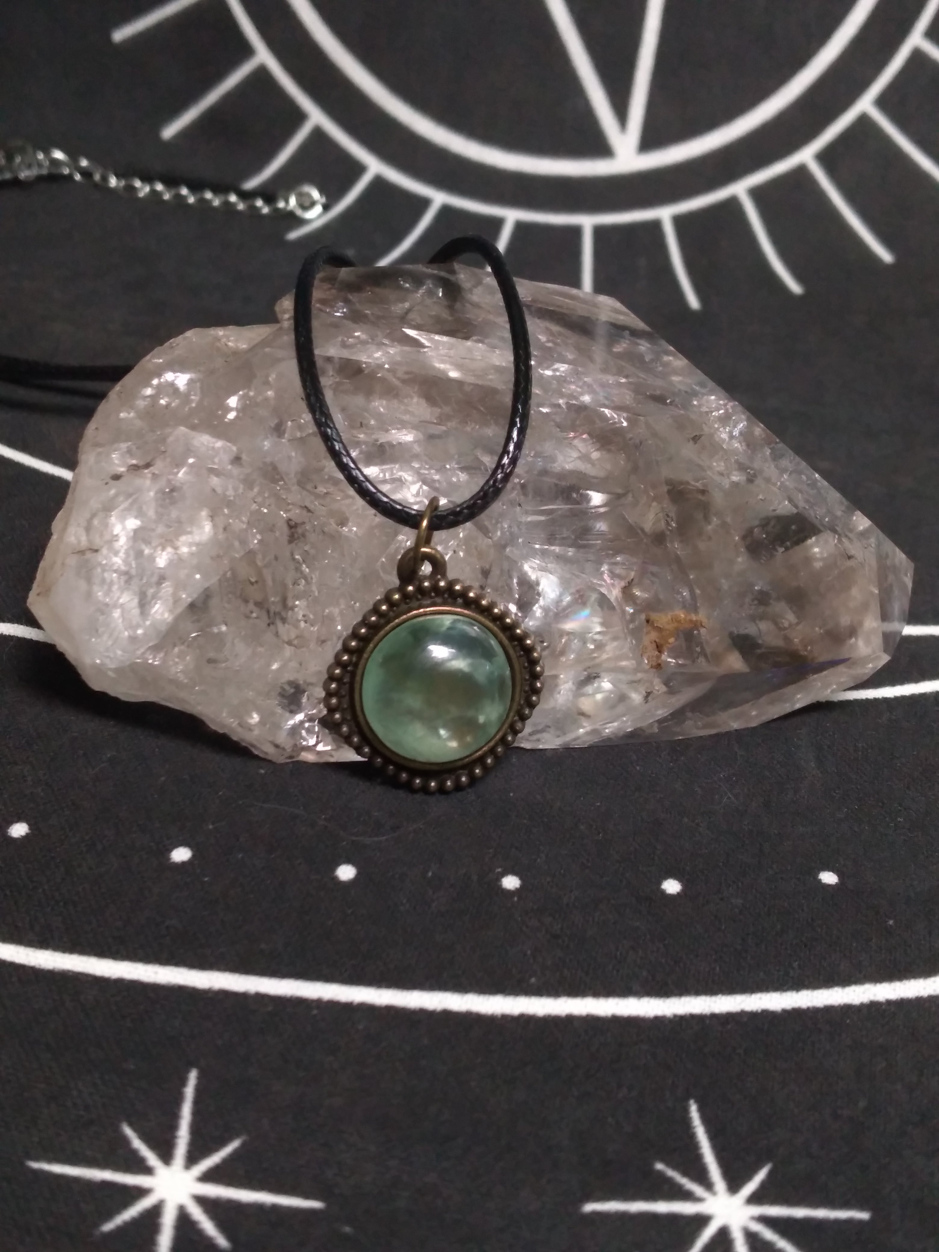 Round prehnite pendant on black cord