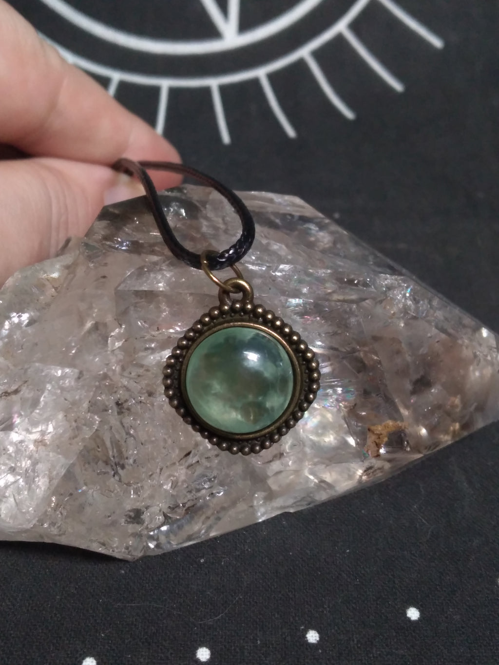 Round prehnite pendant on black cord