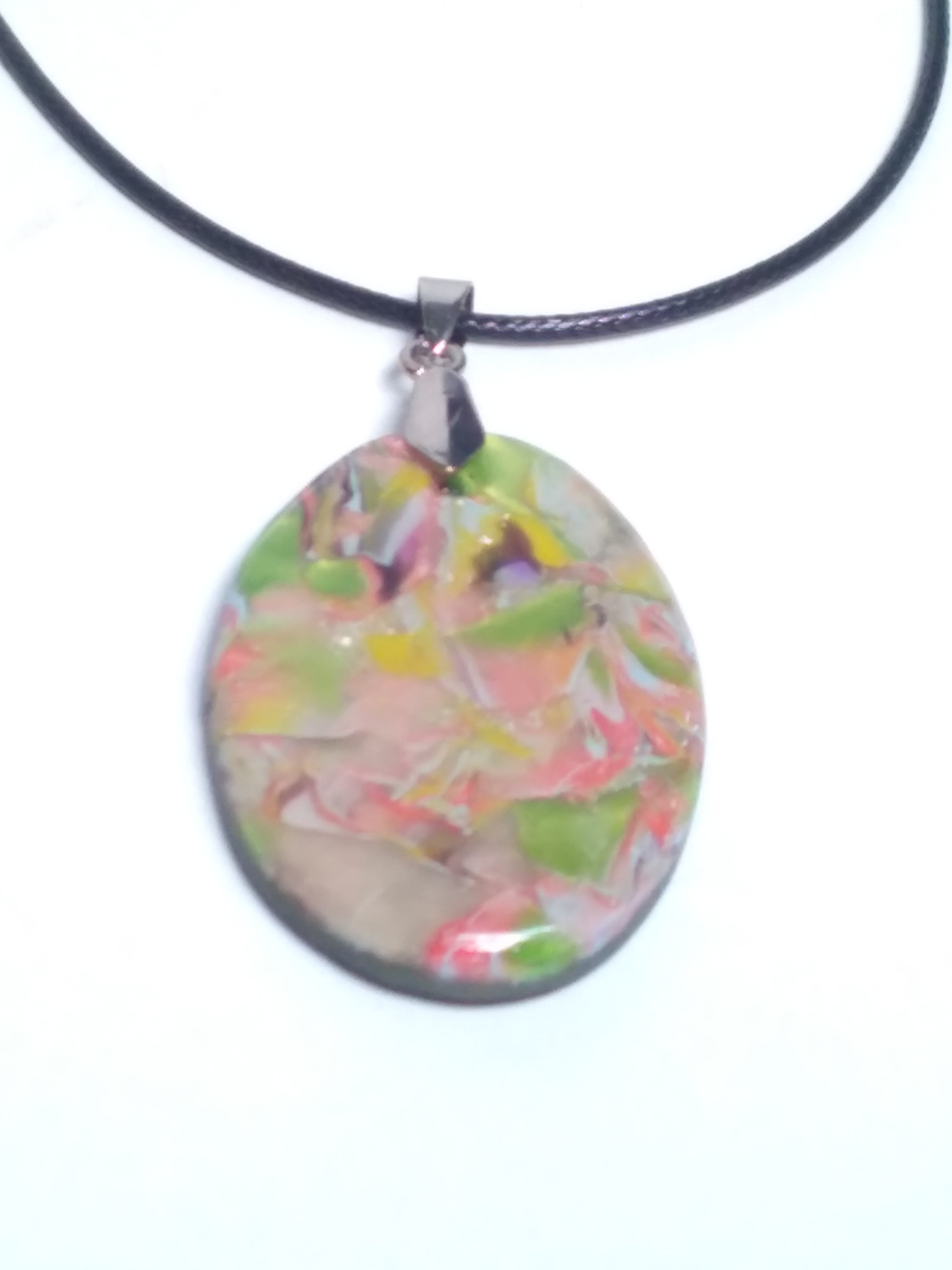 Multicolored pendant on black cord