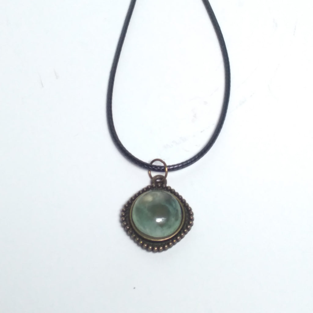 Round prehnite pendant on black cord