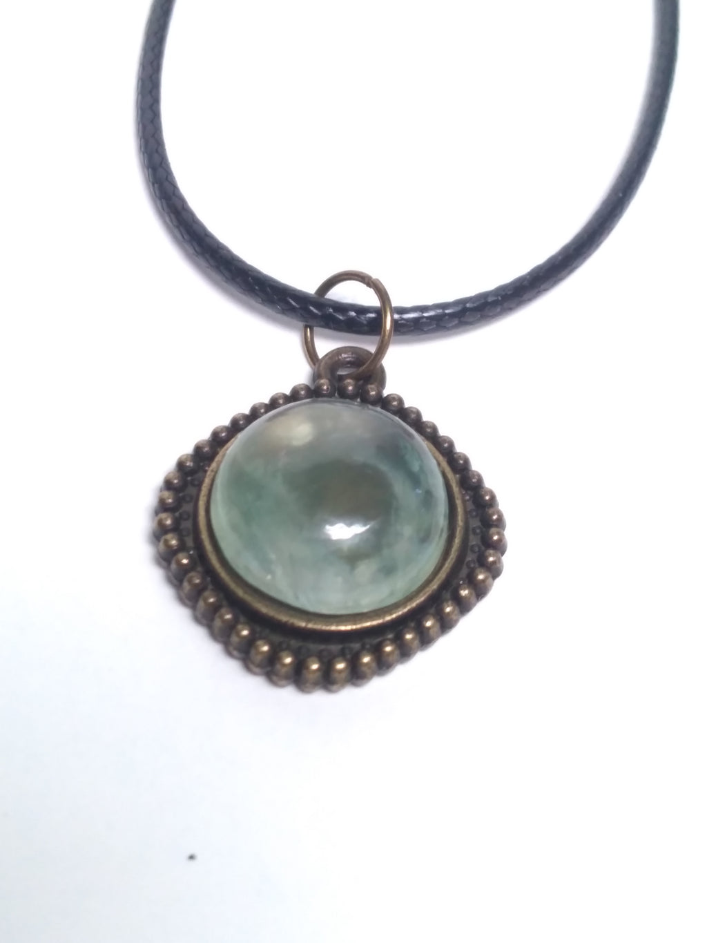 Round prehnite pendant on black cord