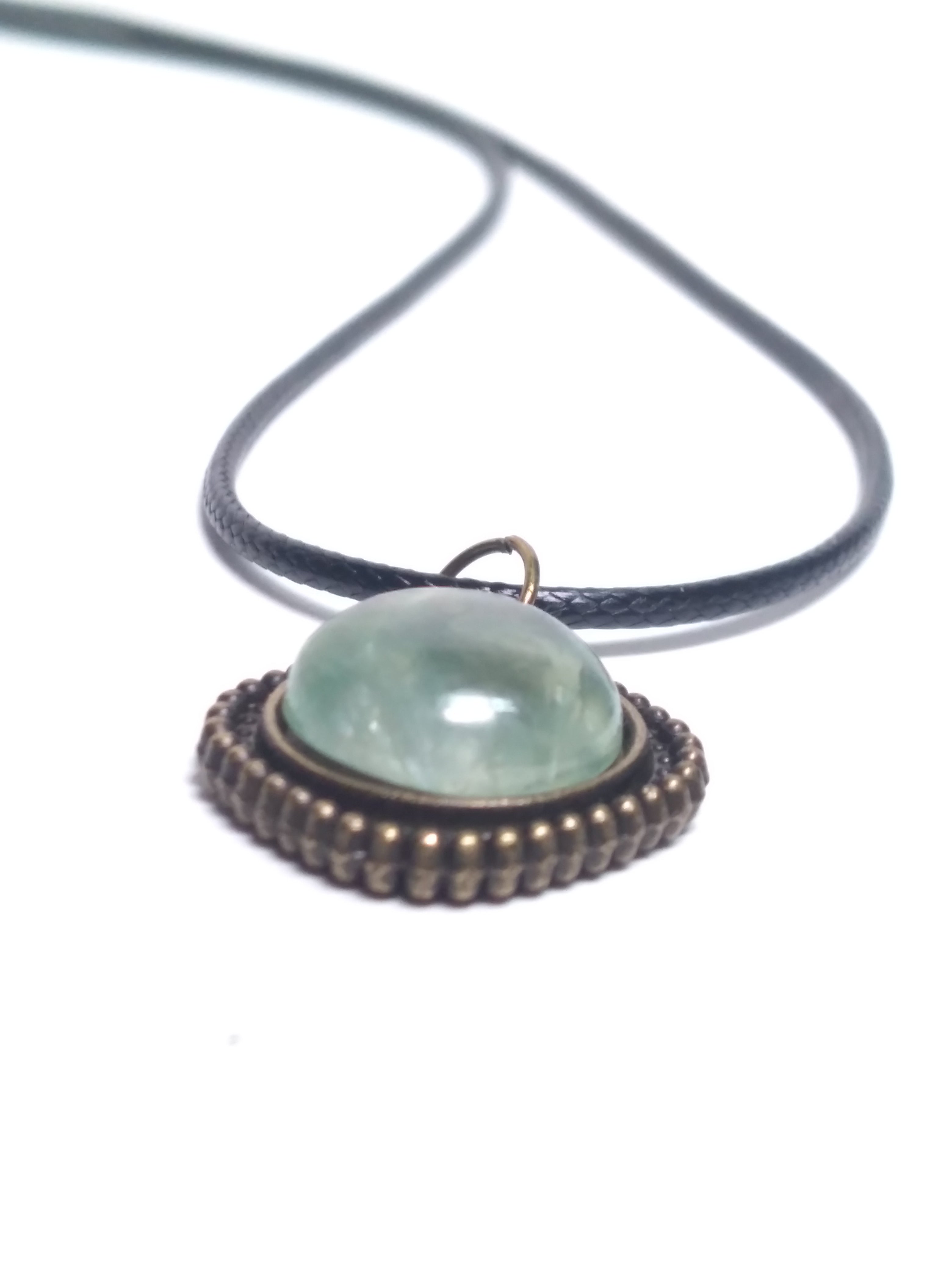 Round prehnite pendant on black cord