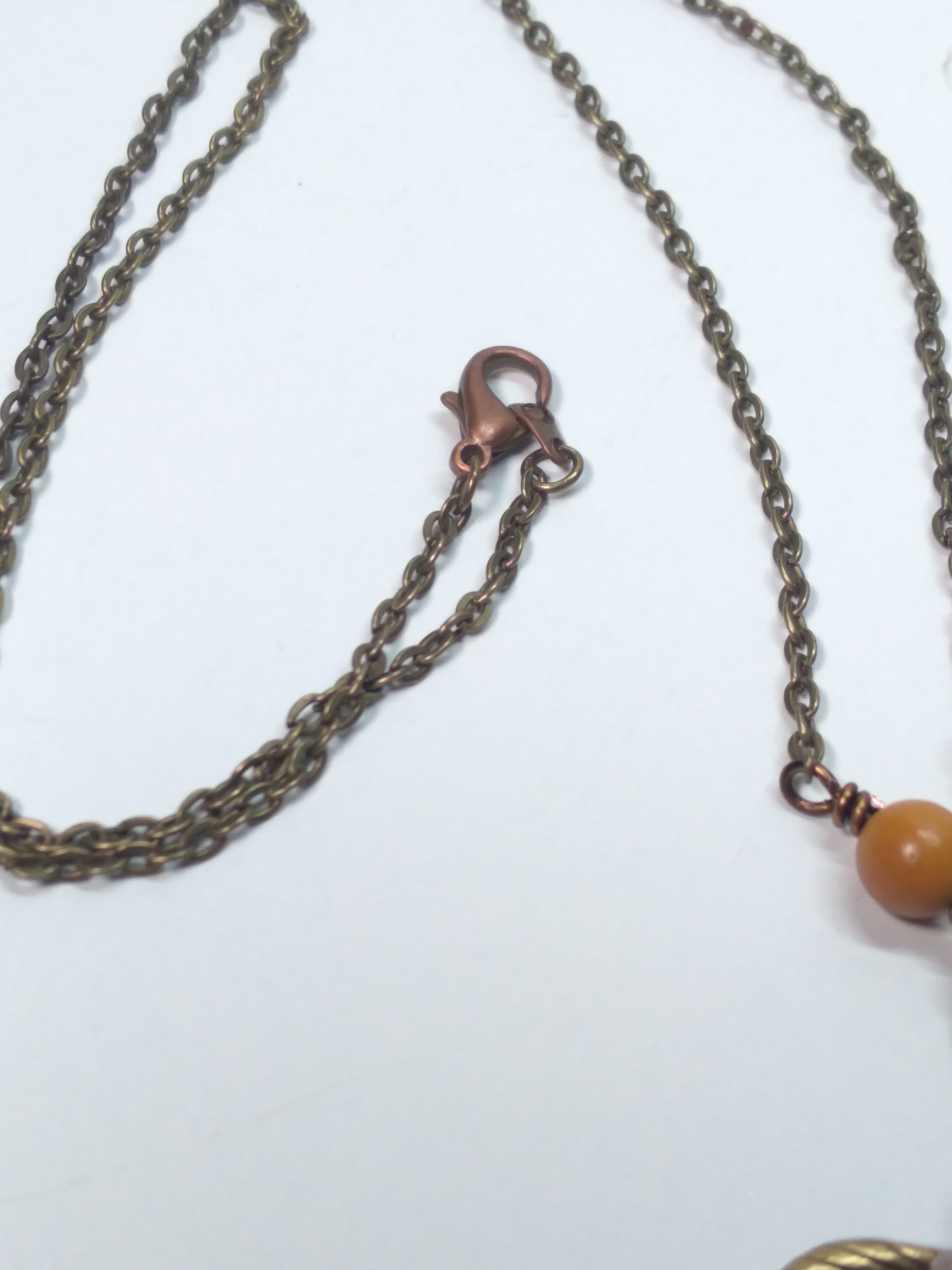 Sunstone and leaf pendant necklace bronze